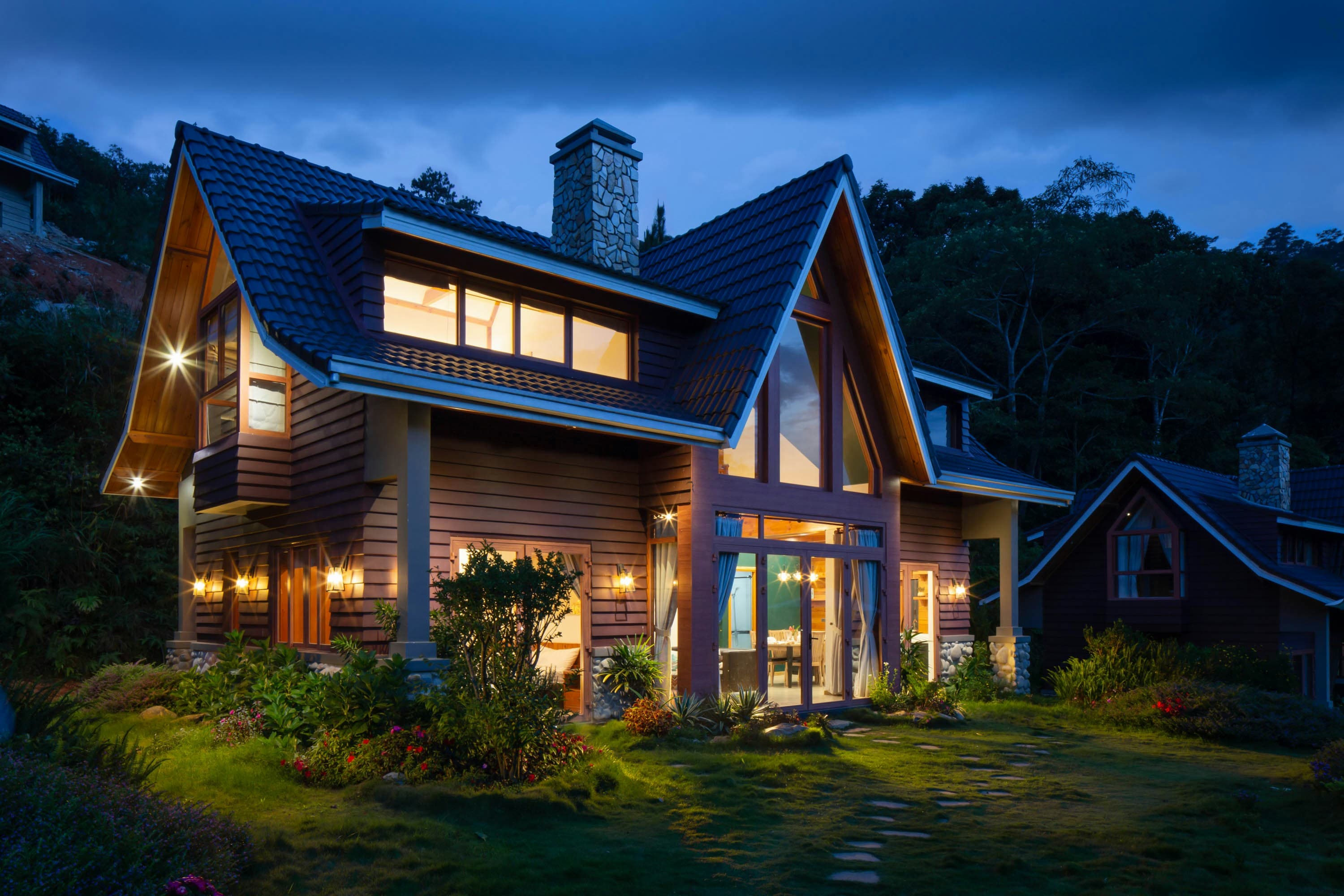 Warmly lit home exterior at dusk